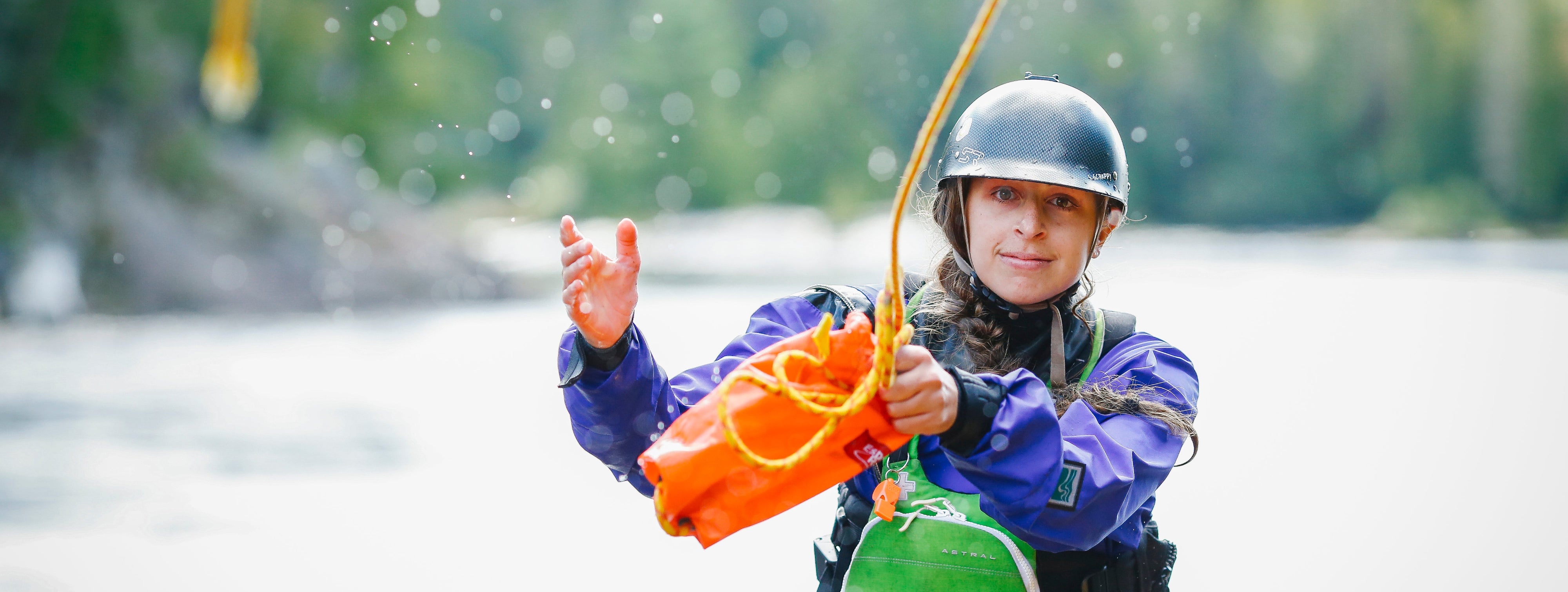 Whitewater rescue participant practicing their throw bag toss