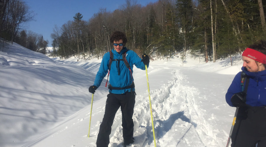 Nordic ski leadership Two cross country skiers smiling on a sunny day