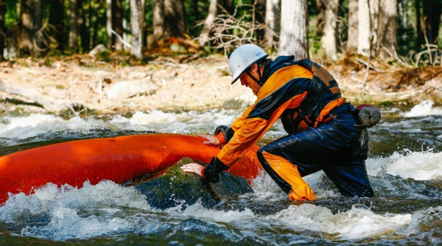 Rescuing a pinned kayak in whitewater