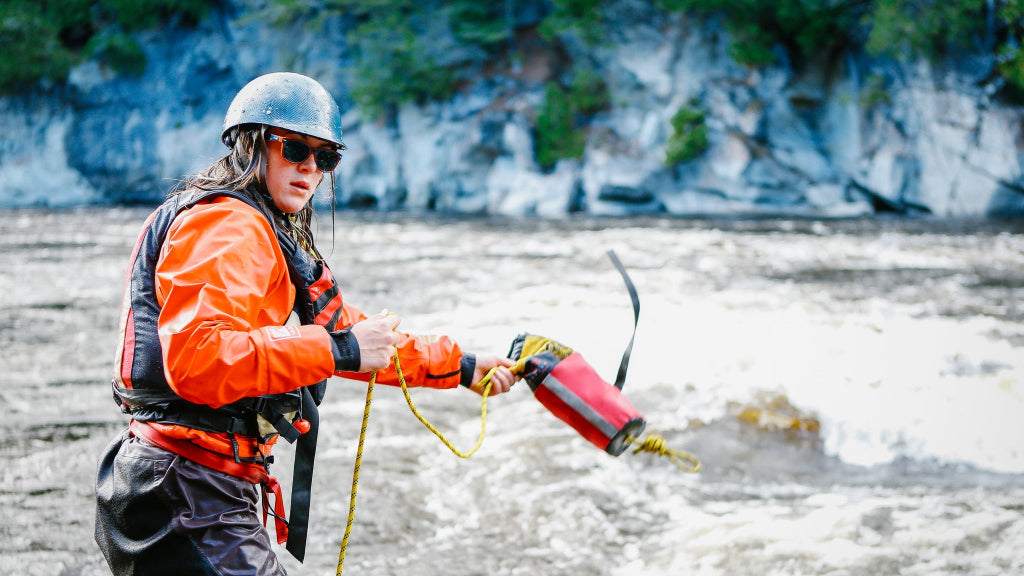 whitewater rescue female student tossing a throw bag